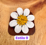 Broches blancos