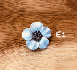Broches blancos