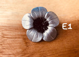 Broches plateados