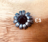 Broches plateados